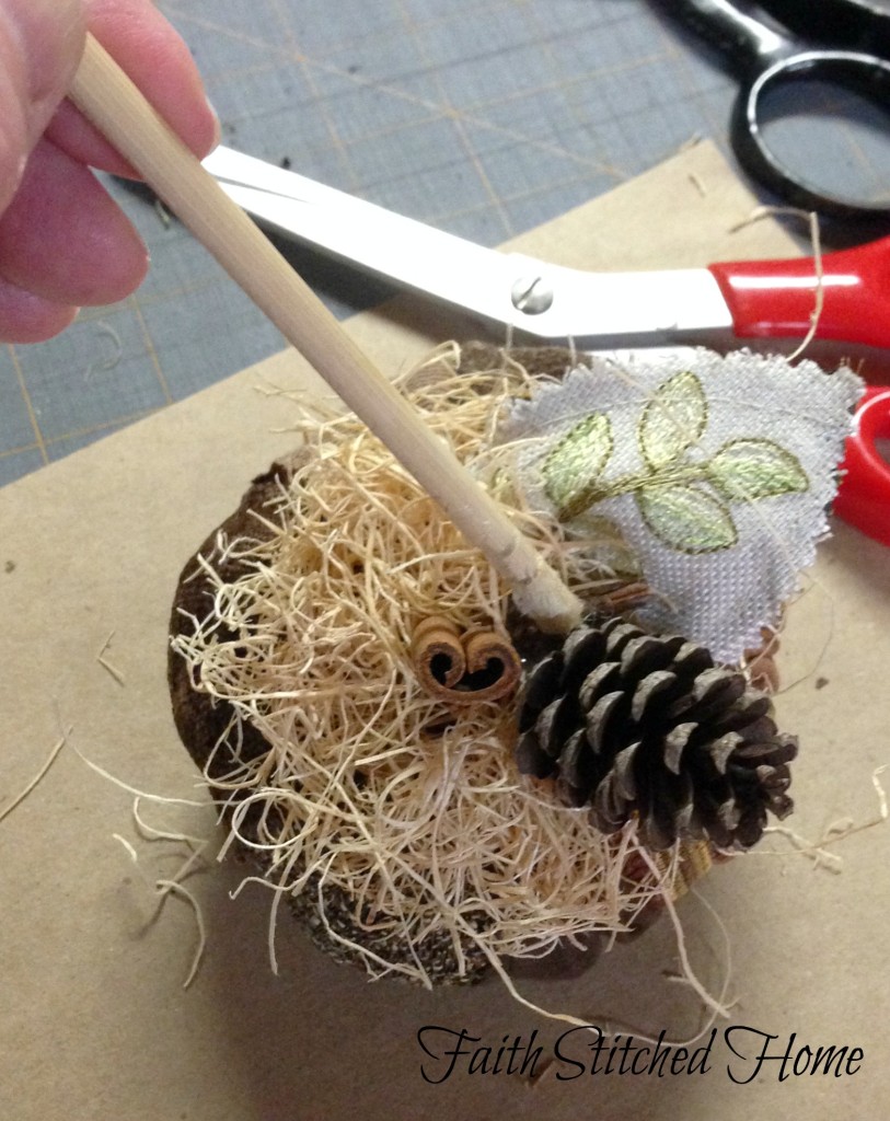 Pumpkin - fabric swatch gluing on pine cone